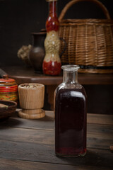 Homemade red wine in a wooden cellar