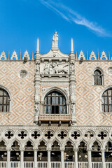 Front view of Doge's Palace (Ducal Palace) with white marble tracery facade in Saint Mark's Square,...
