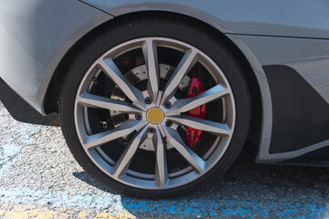 partial view of modern sports car with alloy