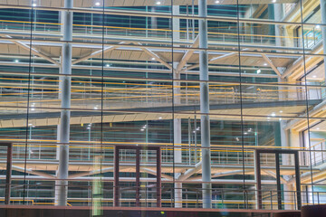 Structure and parking building ramps and levels illuminated at night.