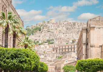 Fototapeta na wymiar Modica (Sicilia, Italy) - A historical center view of the touristic baroque city in province of Ragusa, Sicily island, during the hot summer