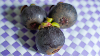 Fresh ripe mangosteen fruit from the garden with natural background Thailand