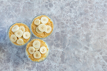 Magnolia banana dessert on the marble table. Top view photo of delicious magnolia dessert.