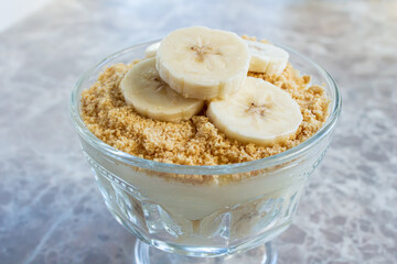 Magnolia banana dessert on the marble table. Closeup photo of delicious magnolia dessert.