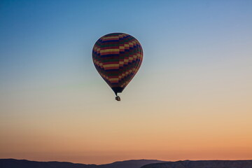 Hot air balloons flying over the valley at Cappadocia, Turkey. G