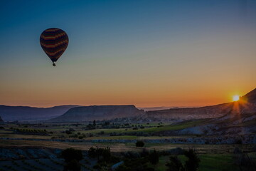 Fototapeta na wymiar Hot air balloons flying over the valley at Cappadocia, Turkey. G