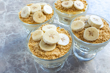 Magnolia banana dessert on the marble table. Closeup photo of delicious magnolia dessert.