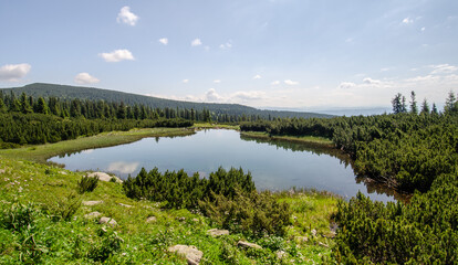 Fototapeta na wymiar View of the mountain glacier lake Iezer in Romania, Calimani mountains, Transylvania.