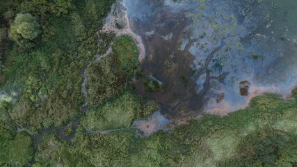 Multicolored spots on the water of the river