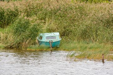 Fishing boat in reeds. A lone boat is waiting for its master.
