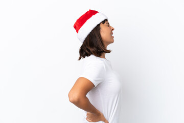 Young mixed race woman celebrating Christmas isolated on white background suffering from backache for having made an effort