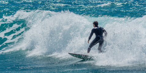 Surfers waiting for the waves in Malta