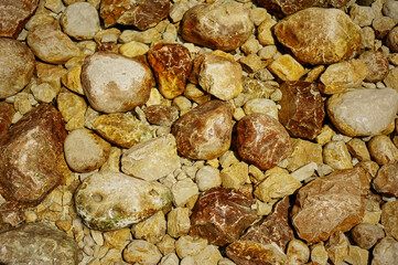 Stones by the mountain river. Heated by the sun and cracked. Ecologically clean places.