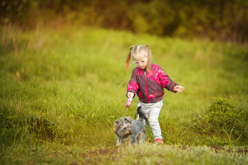 beautiful girl with Down syndrome hugs puppy