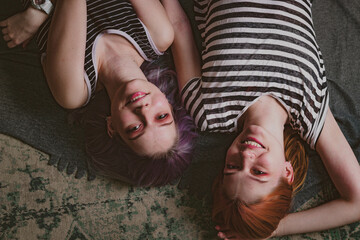 twins in striped t-shirts lie