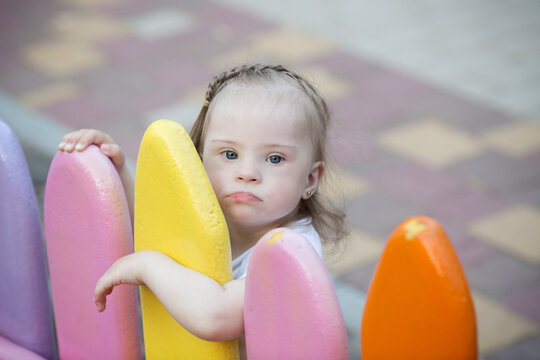 funny little girl with Down's syndrome