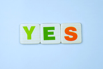 Obraz premium Colorful YES inscription made of squares with letters