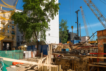 View of the construction of a new house in a dense urban environment