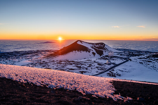 Hawaii Mauna Kea Summit Sunset with Snow, mountaintop sunset above clouds, cinder cone