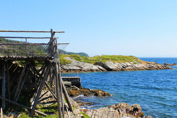 Fototapeta na wymiar A fishing stage and pier on the rocky coastline of Newfoundland, on the Atlantic Ocean.