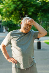 Exhausted elderly man after his jogging workout