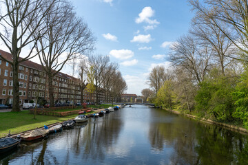 Boats along canal in Mercatorwijk in Amsterdam West in The Netherlands