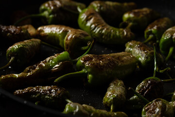 Fried Green Standard Peppers with olive oil, garlic and sea salt, a traditional Spanish tapas recipe.