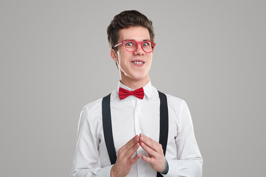 Sly male nerd looking at camera