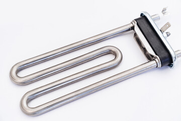 repair of washing machine. new tubular electric heater in hands of a repairman