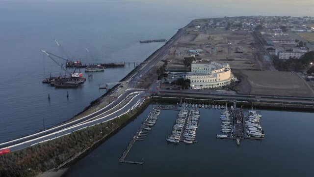 Aerial: Treasure Island construction sites at sunrise. San Francisco, Califrnia, USA
