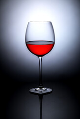 glass of red wine on a dark background