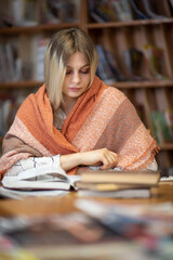 Beautiful smart blonde nerd girl in the library.