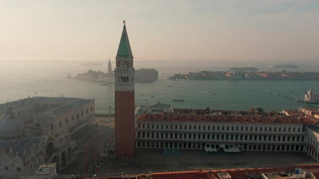Establishing Aerial View of Venice, Italy, European Romantic Touristic City Destination in Adriatic Sea Lagoon. St Mark's Square with Landmarks. 4K orbit panorama 