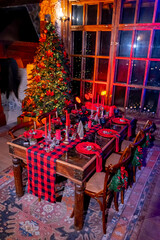 Celebration new year design. Indoor Christmas house interior. Christmas celebrating pretty table. Decorated interior for indoor celebration