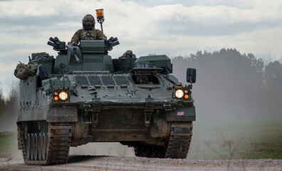 British army Warrior FV512 mechanized recovery vehicle tank in action on military exercise, Salisbury Plain, Wiltshire UK