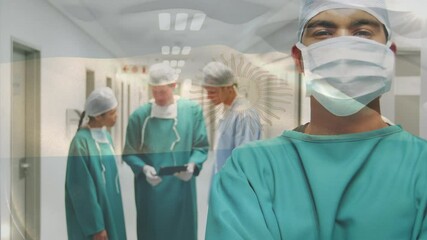 Animation of flag of argentina waving over surgeons in operating theatre - Powered by Adobe