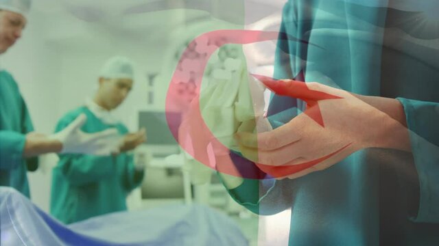 Animation of flag of algeria waving over surgeons in operating theatre