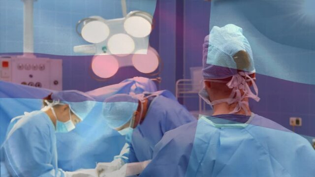 Animation Of Flag Of England Waving Over Surgeons In Operating Theatre