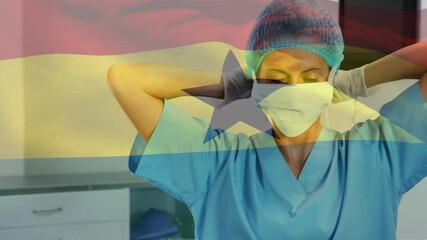 Animation of flag of ghana waving over surgeon in operating theatre - Powered by Adobe