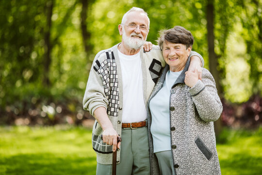 Elderly Couple During A Walk In The Park