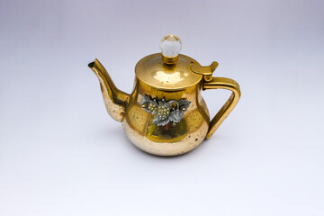 Antique teapot isolated on white background. Stock photo