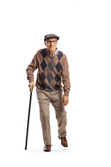 Full length portrait of a bent elderly man walking with a cane