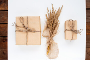 Dried floral bouquet, autumn rustic composition with dry grass and eco friendly gift boxes. Natural...