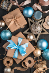New Year's background with gifts and toys in beige and blue. Top view. The concept of Christmas and New Year.
