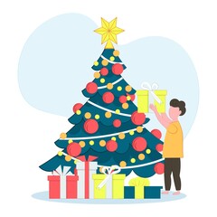 The child opening Christmas gifts for winter holidays. Christmas tree.