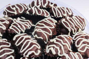 Eid chocolate cookies with dates and white chocolate isolated on white. Homemade Dates Cake or Kue Kurma Stock Photo