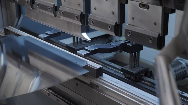 Steel machine metal press industry equipment. Hydraulic press bends. Steel sheet on bending machine forms metal products. Bending metal machine. Metalworking machine tool equipment factory steel plate