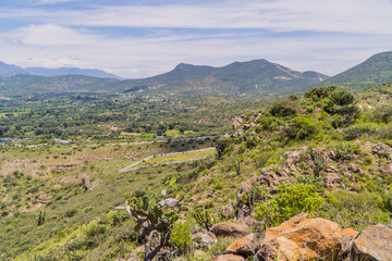 Panorama view landscapes of Hidalgo, Mexico with cactus, green plains,  and mountains near Tasquillo