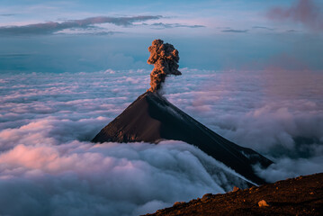 The stunning Volcan de Fuego in Guatemala erupting at sunrise seen from Acatenango Summit - obrazy, fototapety, plakaty