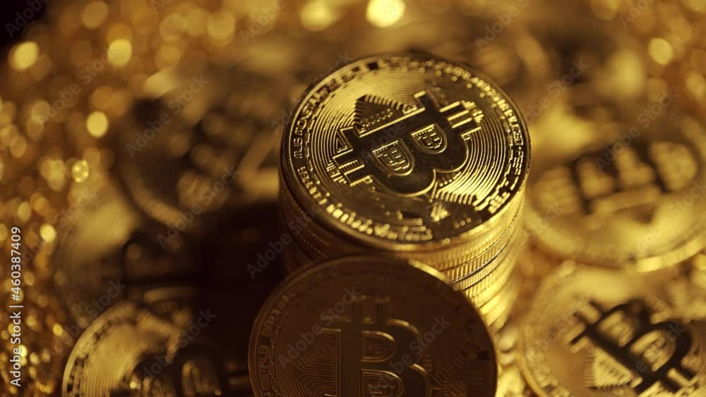 Poster golden bitcoin coins are rotating on a dark background. virtual cryptocurrency payment system and di